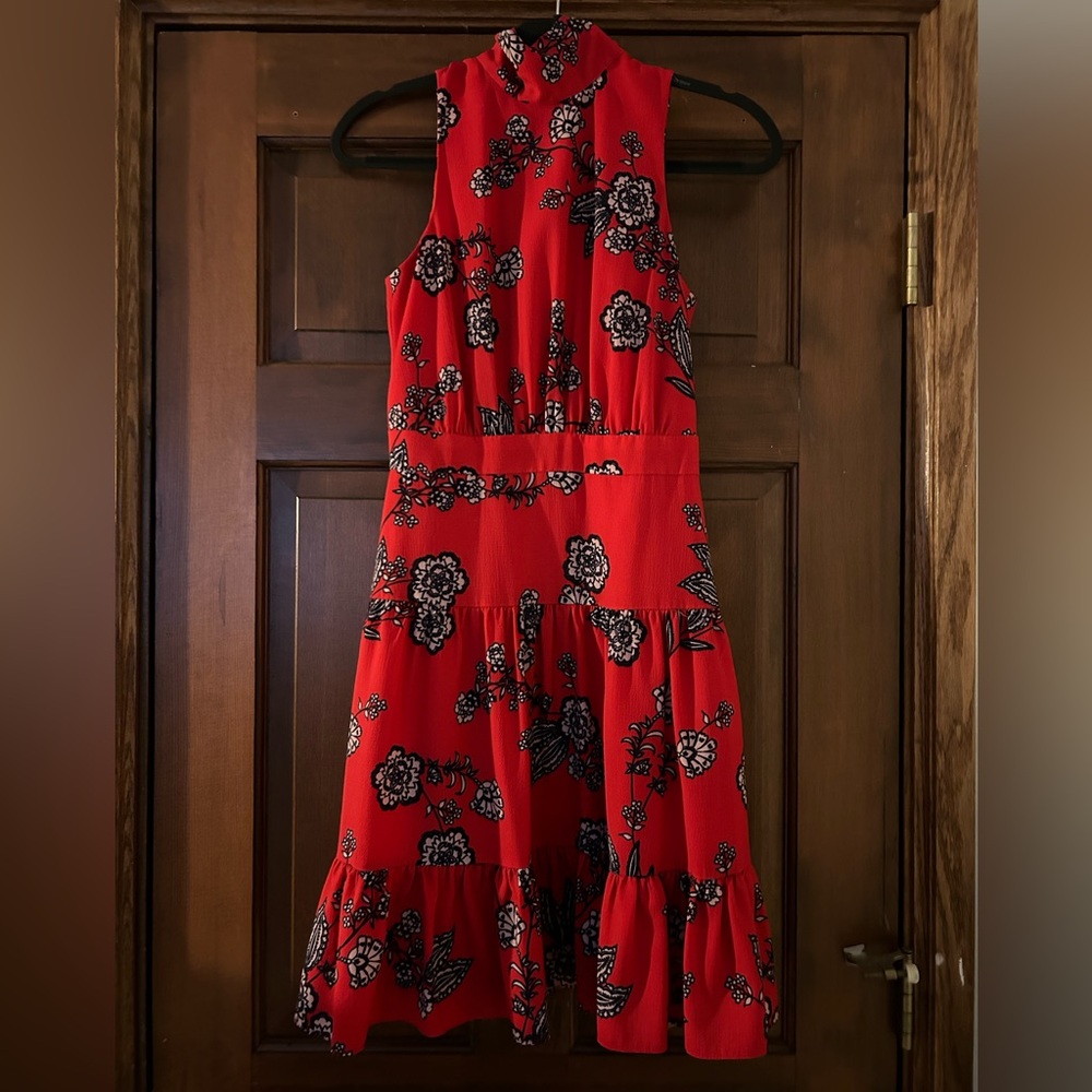 Flirty red dress with white and black floral print! Great movement and bounce.